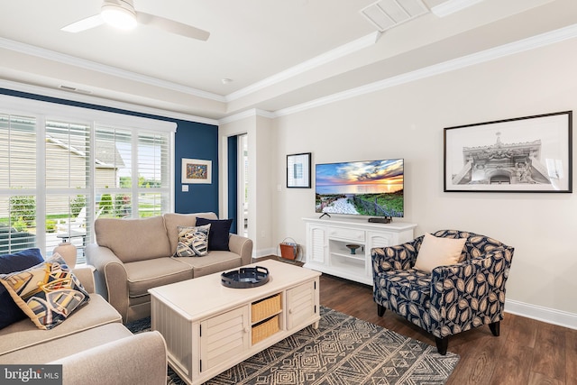 living area featuring crown molding, baseboards, and dark wood-style flooring