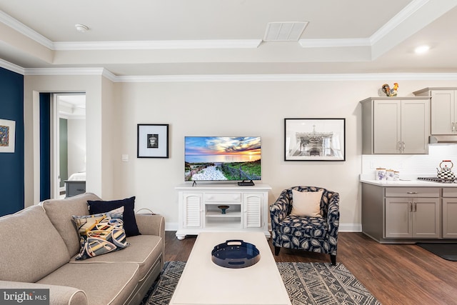 living room with dark wood-style floors, visible vents, crown molding, and baseboards