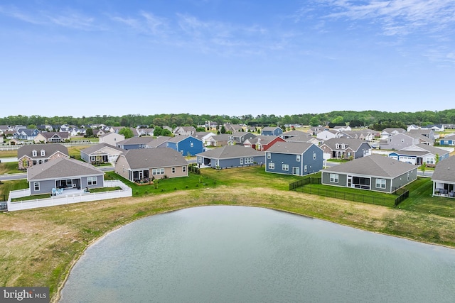 aerial view featuring a residential view and a water view