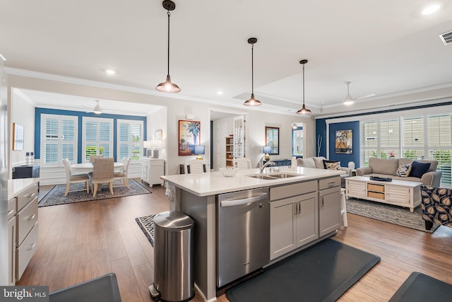 kitchen featuring a sink, open floor plan, dishwasher, and ceiling fan