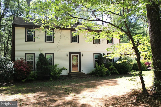 colonial inspired home featuring entry steps