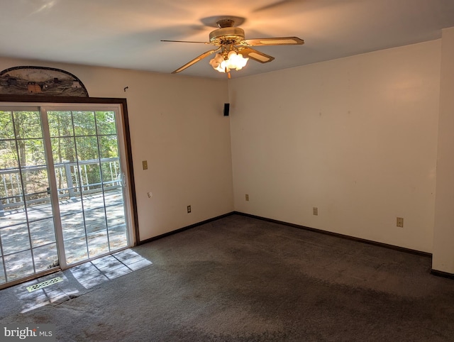carpeted empty room featuring ceiling fan, visible vents, and baseboards