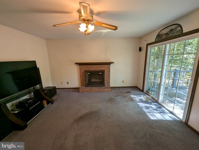 unfurnished living room featuring a fireplace, baseboards, ceiling fan, and carpet