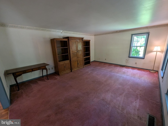 unfurnished bedroom featuring visible vents, carpet, and baseboards