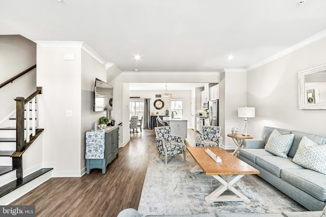 living room with crown molding, stairway, baseboards, and dark wood-style flooring