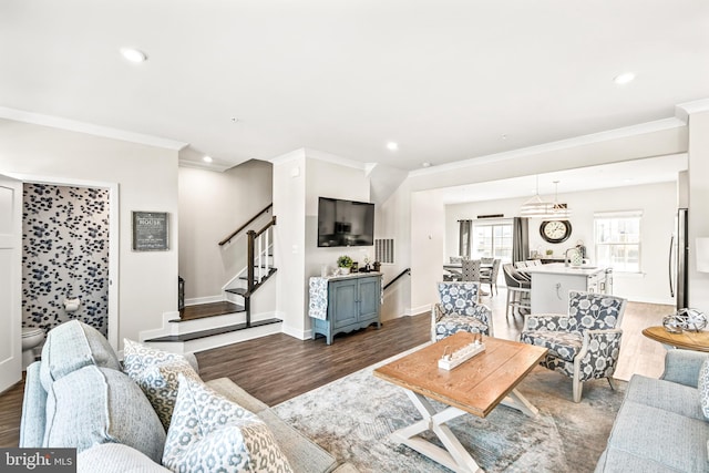 living area with stairs, recessed lighting, and dark wood-style flooring