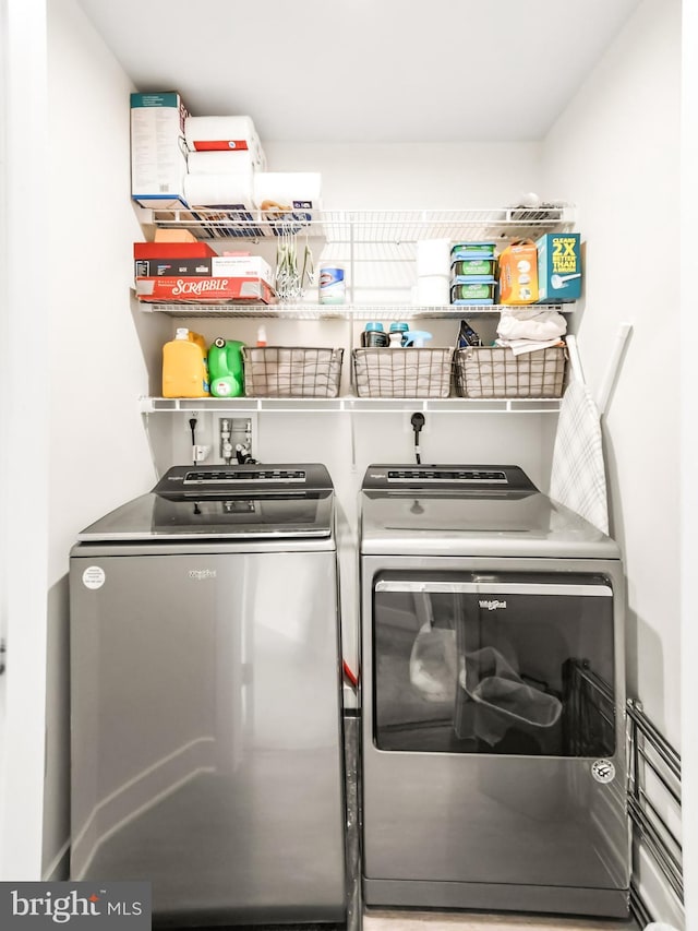 laundry area featuring washing machine and dryer and laundry area