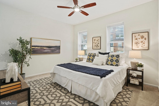 bedroom featuring baseboards, carpet, and a ceiling fan