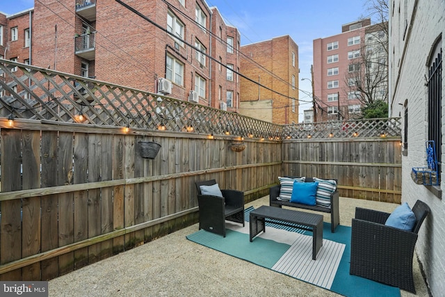 view of patio featuring a fenced backyard and an outdoor hangout area