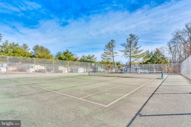 view of tennis court with fence