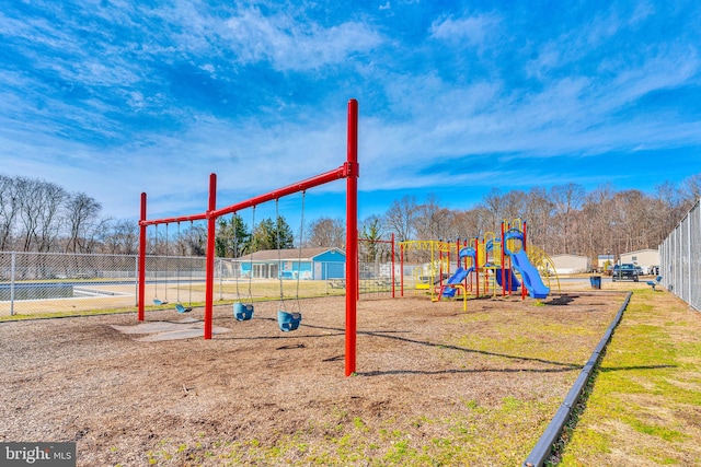 community jungle gym featuring fence