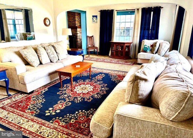 living room featuring arched walkways