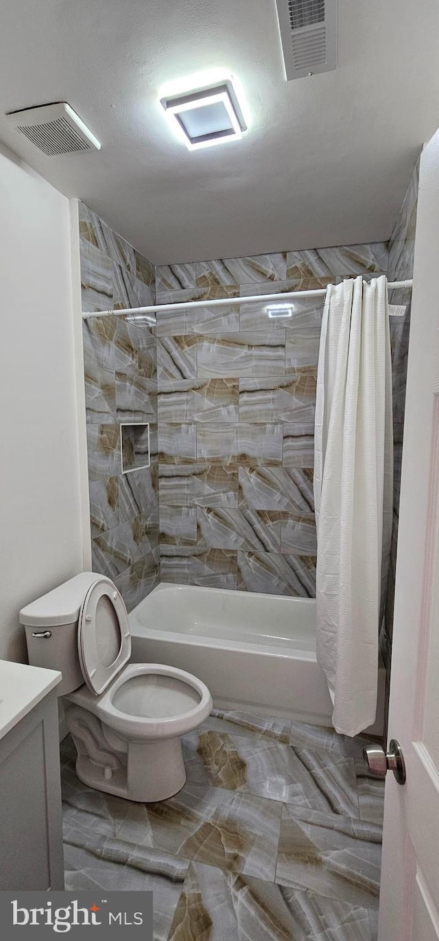 bathroom featuring visible vents, shower / tub combo, toilet, and vanity