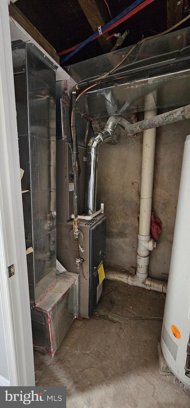 utility room featuring gas water heater