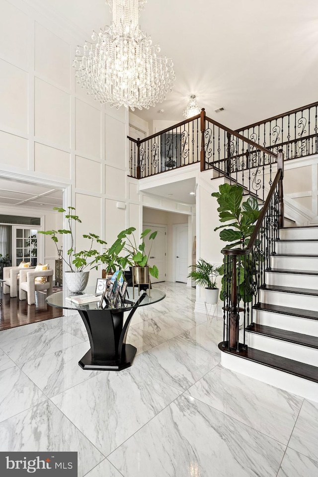 building lobby featuring visible vents and stairs