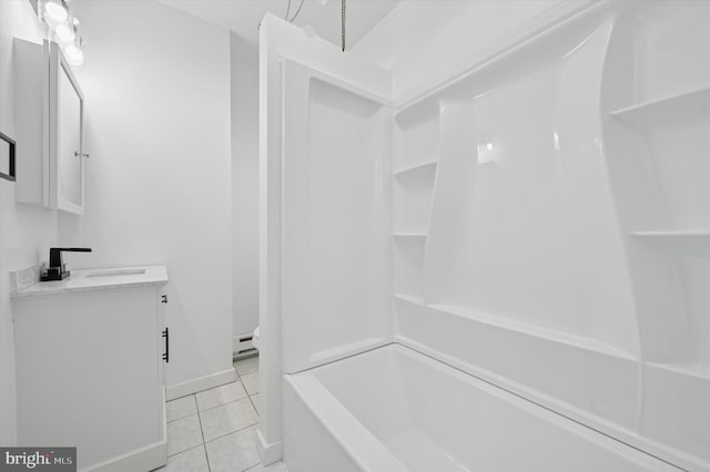 bathroom featuring tile patterned flooring, a baseboard heating unit, baseboards, shower / washtub combination, and vanity