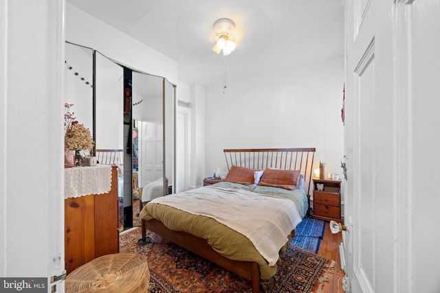 bedroom with wood finished floors