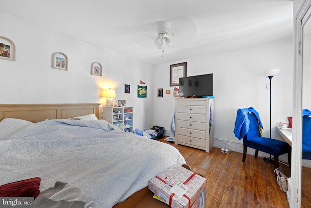 bedroom featuring ceiling fan and wood finished floors