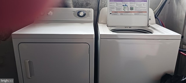 laundry area with washing machine and dryer and laundry area