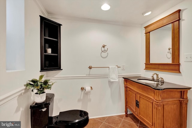 half bathroom with vanity, recessed lighting, crown molding, toilet, and tile patterned floors