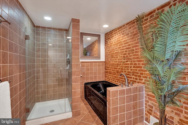 full bathroom with tile patterned floors, a garden tub, a stall shower, and recessed lighting