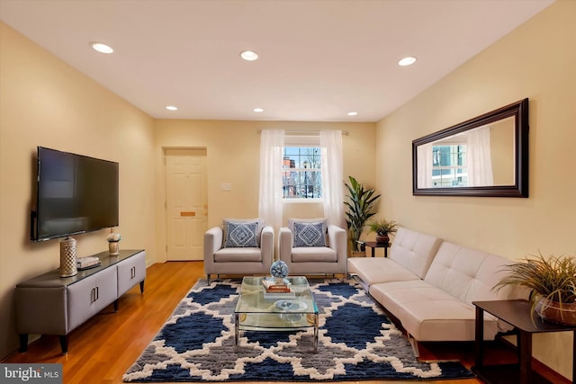 living room featuring recessed lighting and wood finished floors