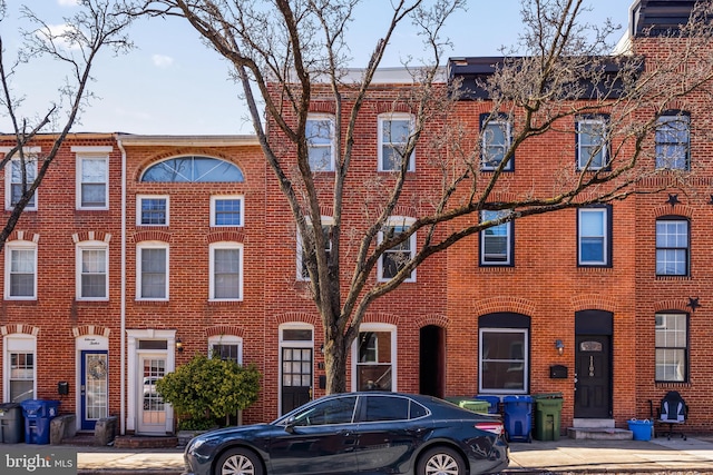 view of property with brick siding