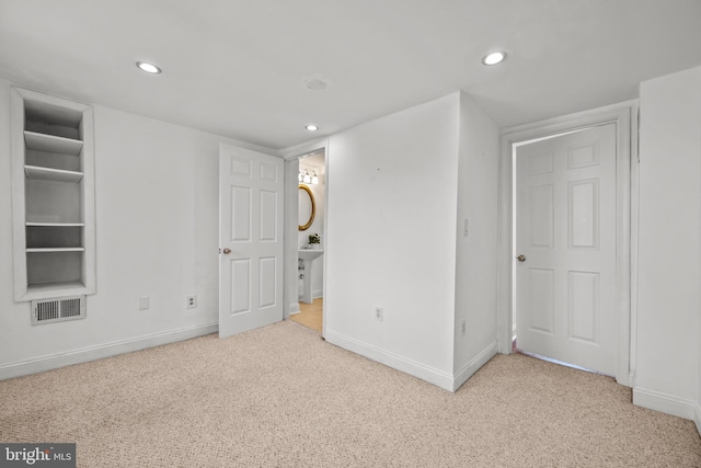 unfurnished bedroom with recessed lighting, visible vents, carpet floors, and baseboards