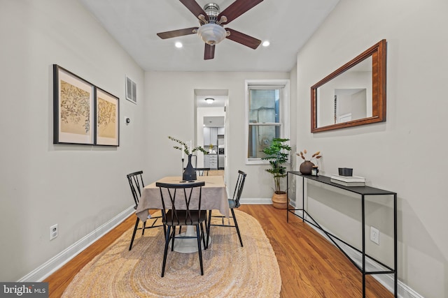 dining space featuring visible vents, baseboards, recessed lighting, light wood-style flooring, and a ceiling fan