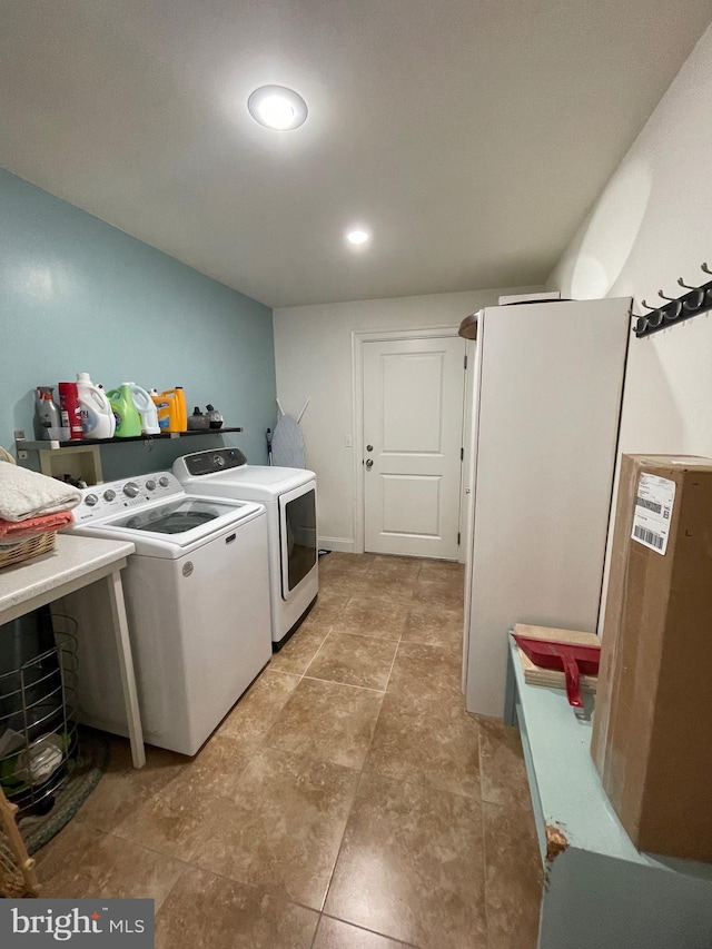 laundry area with separate washer and dryer and laundry area