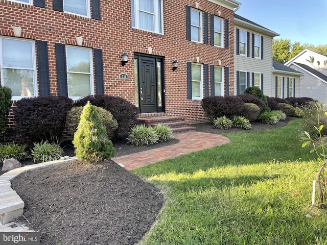 view of front facade featuring brick siding