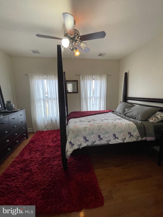 bedroom with visible vents and ceiling fan