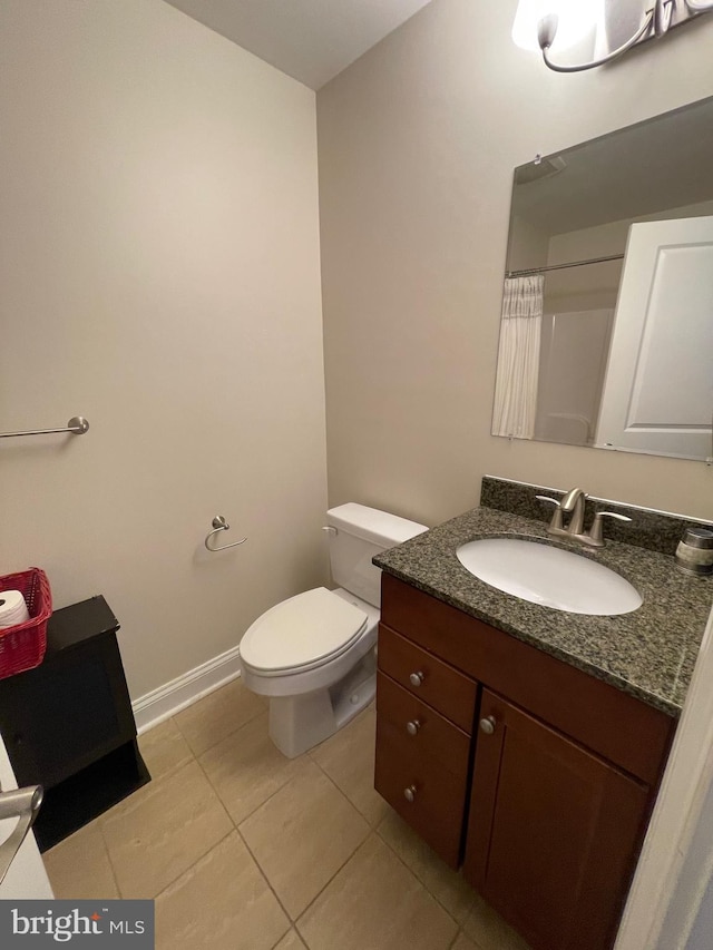 full bathroom with baseboards, toilet, a shower with shower curtain, tile patterned floors, and vanity