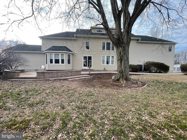 back of property with a patio area
