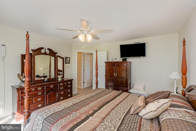 carpeted bedroom featuring baseboards and ceiling fan