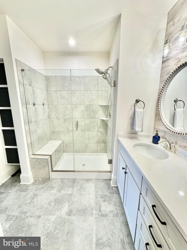 bathroom featuring vanity and a stall shower