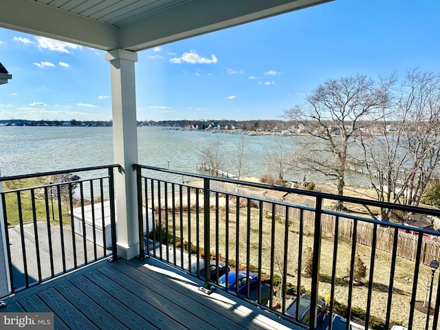 wooden deck featuring a water view