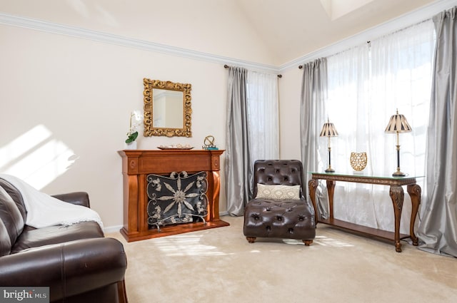 living area with a fireplace, crown molding, lofted ceiling, and carpet floors