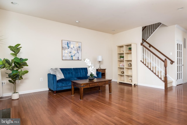 living area featuring stairs, recessed lighting, wood finished floors, and baseboards