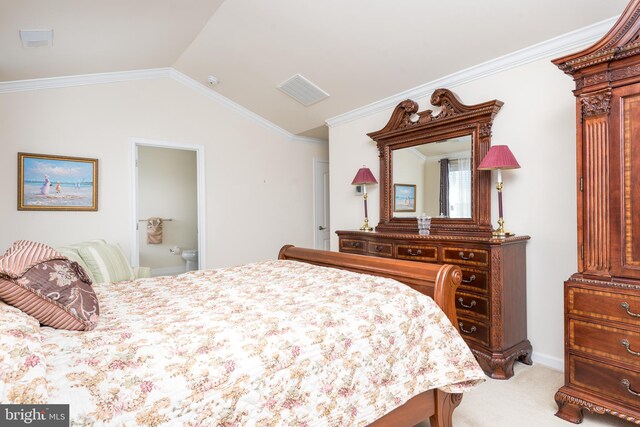 bedroom with connected bathroom, lofted ceiling, carpet flooring, and crown molding