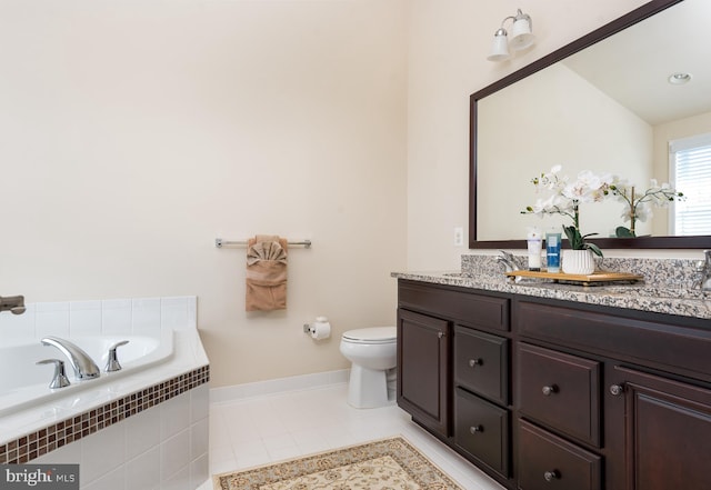 bathroom with a garden tub, toilet, a sink, tile patterned flooring, and double vanity