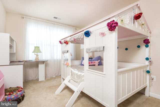 carpeted bedroom with visible vents