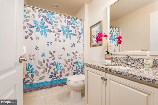 full bathroom featuring tile patterned floors, toilet, and vanity