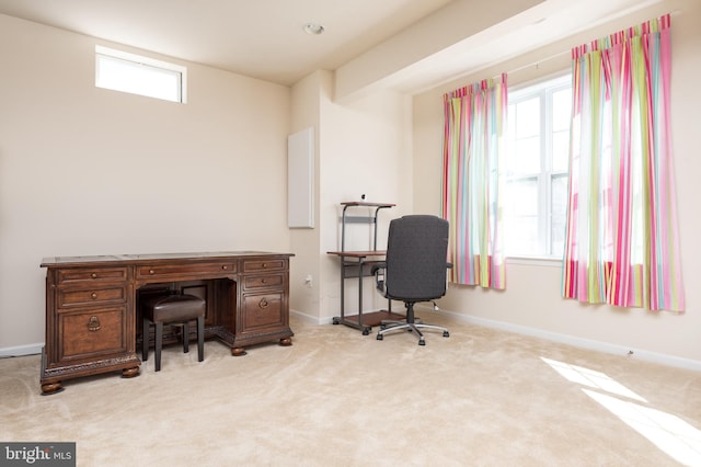 carpeted office featuring baseboards and plenty of natural light