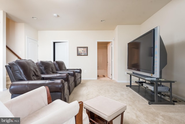 living room featuring recessed lighting, light colored carpet, and baseboards