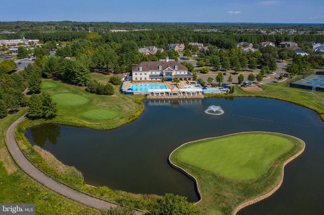 drone / aerial view with a water view and view of golf course