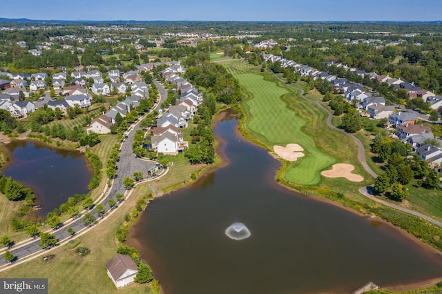 aerial view featuring a residential view, golf course view, and a water view