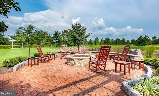 view of patio with a fire pit