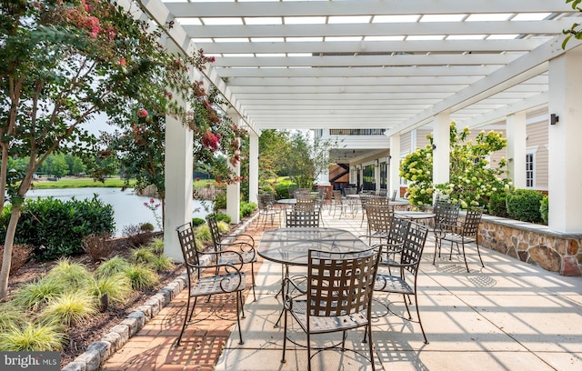 view of patio with outdoor dining area and a pergola