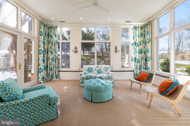 sunroom with visible vents, french doors, and ceiling fan